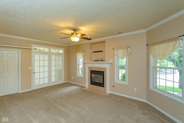 3631 Senior Pl, West Lafayette, IN 47906 - unfurnished living room featuring ceiling fan, a tiled fireplace, carpet flooring, ornamental molding, and a textured ceiling