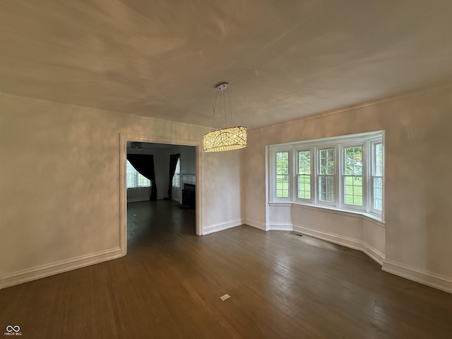 2607 N Henderson Rd, Rushville, IN 46173 - unfurnished dining area featuring dark wood-style flooring and baseboards