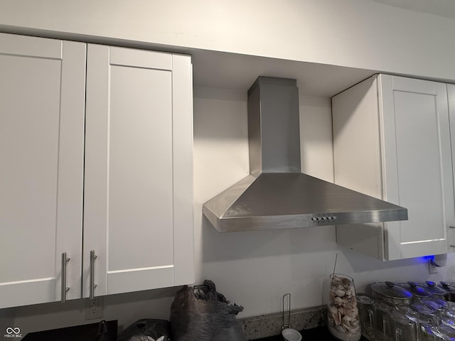2607 N Henderson Rd, Rushville, IN 46173 - kitchen view of wall chimney range hood and white cabinets
