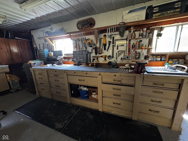 8664 S Nash Dr, Nineveh, IN 46164 - miscellaneous room featuring a workshop area, healthy amount of natural light, and concrete flooring