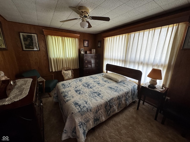 8664 S Nash Dr, Nineveh, IN 46164 - carpeted bedroom with wood walls and ceiling fan
