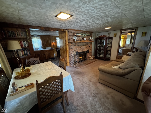 8664 S Nash Dr, Nineveh, IN 46164 - carpeted living room featuring a brick fireplace and wood walls