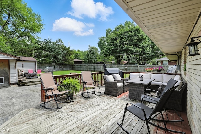 7113 Chandler Dr, Indianapolis, IN 46217 - wooden deck featuring a fenced backyard, an outdoor hangout area, and view of wooded area