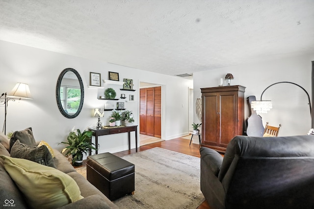 7113 Chandler Dr, Indianapolis, IN 46217 - living area featuring a textured ceiling and wood finished floors