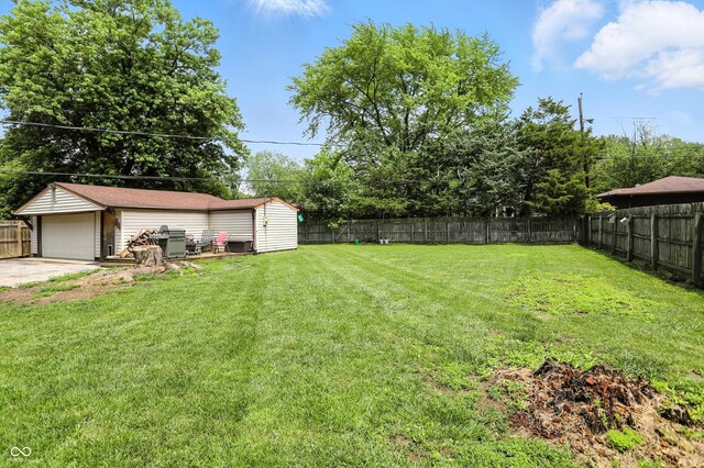 7113 Chandler Dr, Indianapolis, IN 46217 - fenced backyard with an outdoor structure and a detached garage
