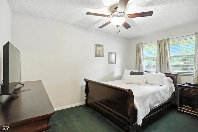 7113 Chandler Dr, Indianapolis, IN 46217 - bedroom featuring dark carpet, a textured ceiling, and ceiling fan