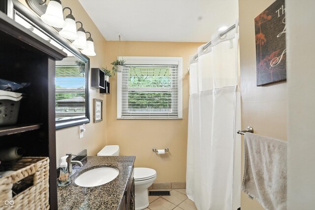 7113 Chandler Dr, Indianapolis, IN 46217 - full bath with tile patterned floors, vanity, and a shower with curtain