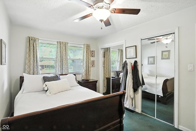 7113 Chandler Dr, Indianapolis, IN 46217 - bedroom with dark colored carpet, a textured ceiling, and a ceiling fan