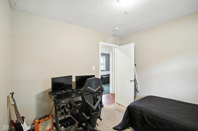 7113 Chandler Dr, Indianapolis, IN 46217 - carpeted bedroom with a textured ceiling