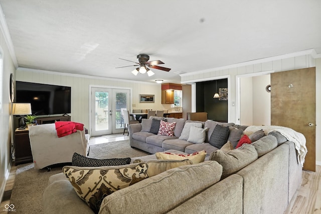 7113 Chandler Dr, Indianapolis, IN 46217 - living area featuring ornamental molding, ceiling fan, french doors, and light wood finished floors