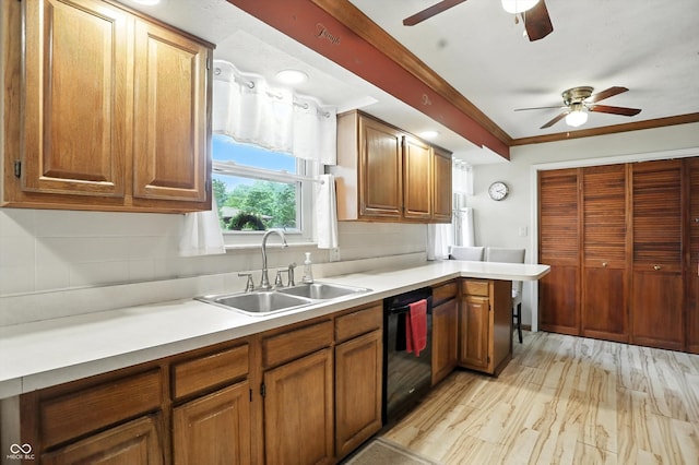 7113 Chandler Dr, Indianapolis, IN 46217 - kitchen with dishwasher, a ceiling fan, backsplash, brown cabinets, and light wood-type flooring