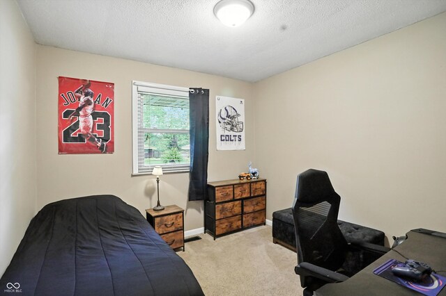 7113 Chandler Dr, Indianapolis, IN 46217 - carpeted bedroom with a textured ceiling and baseboards