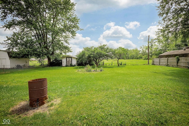 1217 S Post Rd, Indianapolis, IN 46239 - view of yard featuring a storage shed