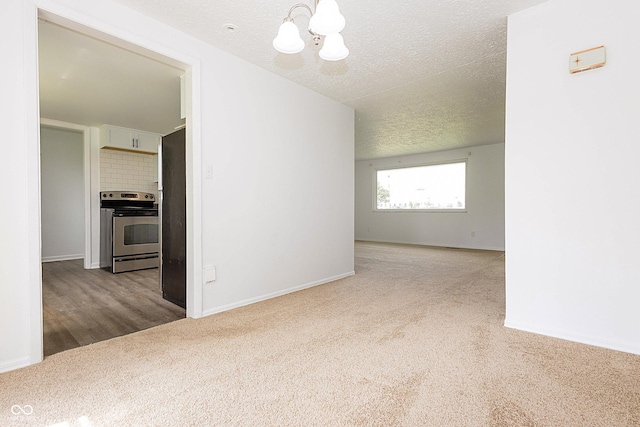 1217 S Post Rd, Indianapolis, IN 46239 - carpeted spare room with a chandelier and a textured ceiling