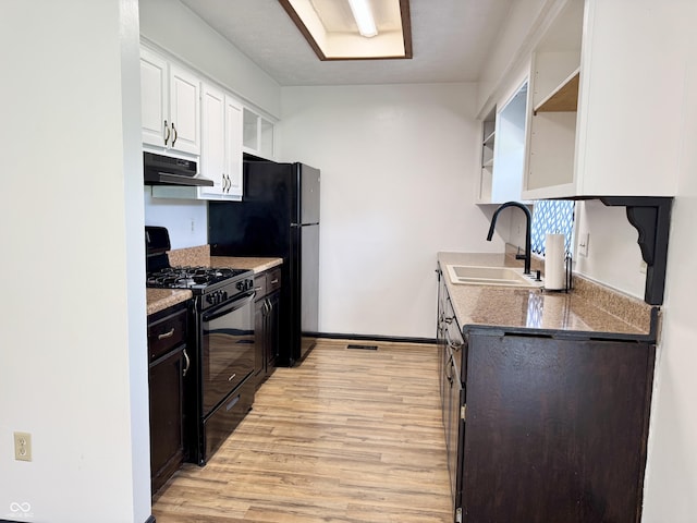 100 Justin Dr, Mooresville, IN 46158 - kitchen with black appliances, open shelves, ventilation hood, light wood-type flooring, and white cabinets