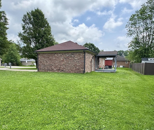 100 Justin Dr, Mooresville, IN 46158 - back of property featuring brick siding and a shingled roof