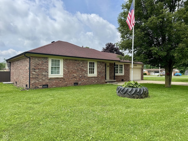 100 Justin Dr, Mooresville, IN 46158 - view of front of home with concrete driveway, an attached garage, brick siding, and a front lawn