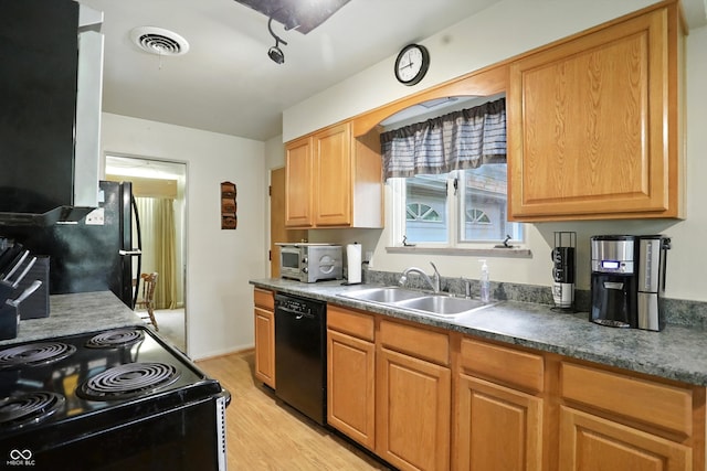 4340 Ashbourne Ln, Indianapolis, IN 46226 - kitchen with black appliances, light wood-style floors, and dark countertops