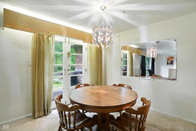 4340 Ashbourne Ln, Indianapolis, IN 46226 - dining space with a chandelier, light colored carpet, and plenty of natural light