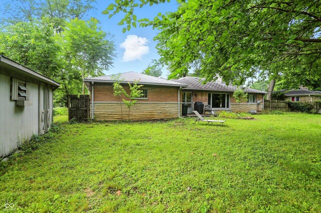4340 Ashbourne Ln, Indianapolis, IN 46226 - rear view of property featuring stone siding