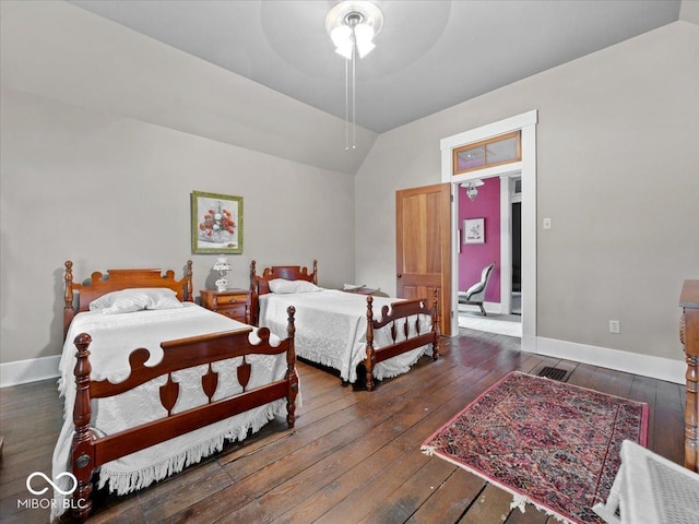 228 W Washington St, Shelbyville, IN 46176 - bedroom featuring wood-type flooring, vaulted ceiling, and a ceiling fan