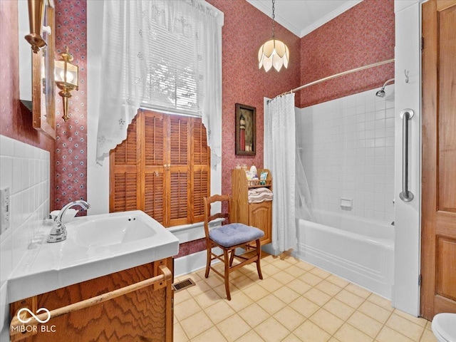 228 W Washington St, Shelbyville, IN 46176 - full bath featuring vanity, shower / bath combination with curtain, tile patterned flooring, crown molding, and wallpapered walls