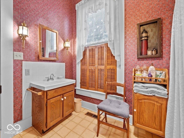 228 W Washington St, Shelbyville, IN 46176 - bathroom with wallpapered walls, vanity, and tile patterned flooring