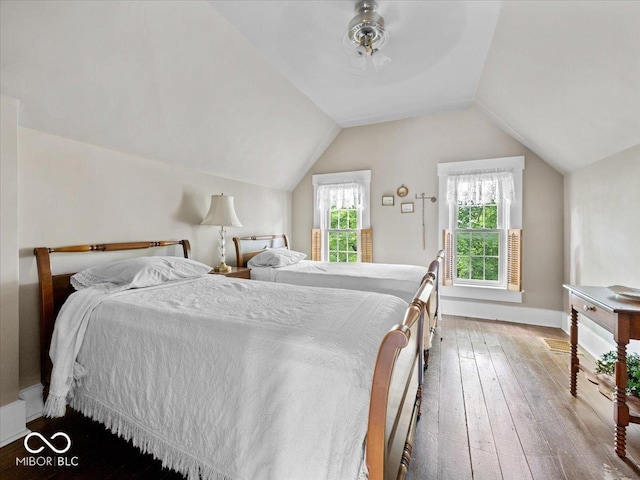 228 W Washington St, Shelbyville, IN 46176 - bedroom with hardwood / wood-style floors and lofted ceiling