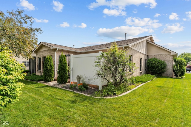 564 Parkhurst Ct, Greenwood, IN 46142 - view of home's exterior featuring brick siding and a yard
