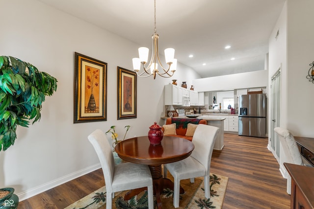 564 Parkhurst Ct, Greenwood, IN 46142 - dining area with a chandelier, dark wood finished floors, lofted ceiling, and recessed lighting