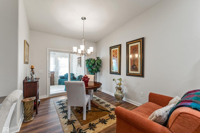 564 Parkhurst Ct, Greenwood, IN 46142 - dining space with a chandelier, dark wood finished floors, and lofted ceiling