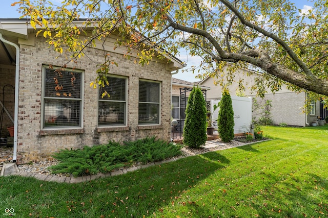 564 Parkhurst Ct, Greenwood, IN 46142 - view of side of home with a lawn and brick siding