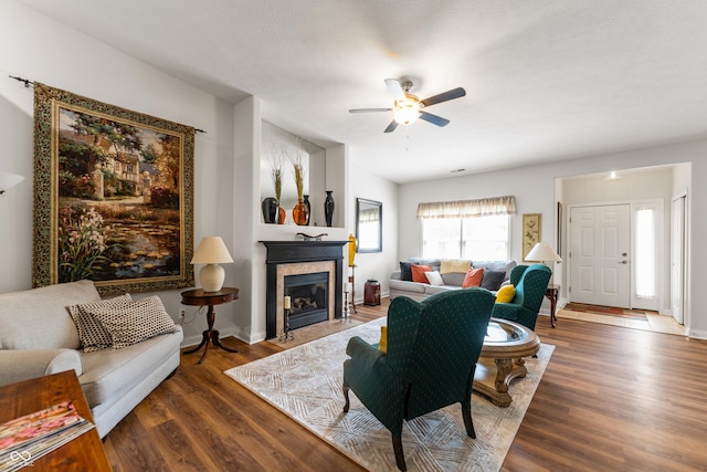 564 Parkhurst Ct, Greenwood, IN 46142 - living room featuring ceiling fan, a fireplace with flush hearth, and wood finished floors