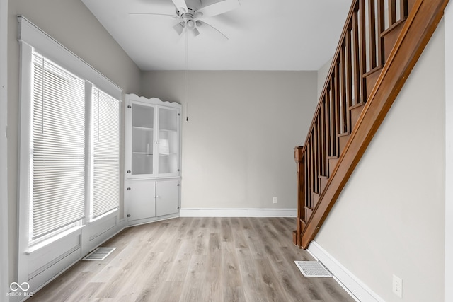 1310 California St, Columbus, IN 47201 - entryway featuring ceiling fan, light wood-style flooring, and stairway