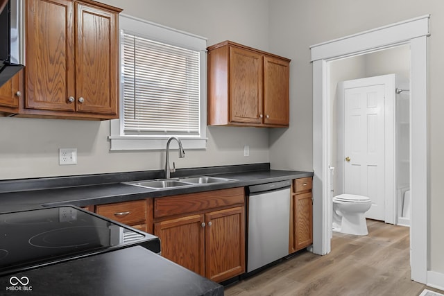 1310 California St, Columbus, IN 47201 - kitchen featuring dishwasher, light wood finished floors, electric stove, brown cabinetry, and dark countertops