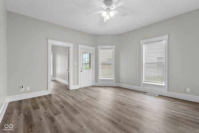 1310 California St, Columbus, IN 47201 - unfurnished room with ceiling fan and wood finished floors