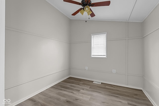 1310 California St, Columbus, IN 47201 - empty room with vaulted ceiling, a ceiling fan, and wood finished floors