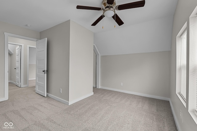 1310 California St, Columbus, IN 47201 - unfurnished bedroom with carpet floors, vaulted ceiling, and a ceiling fan