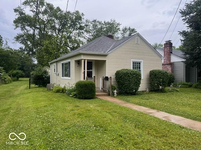 111 S Jefferson St, Brownsburg, IN 46112 - bungalow with a front yard, a chimney, and a shingled roof