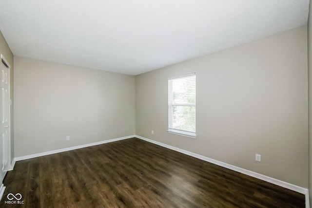 8310 Becks Mill Ln, Indianapolis, IN 46113 - unfurnished bedroom with dark wood-style flooring and baseboards