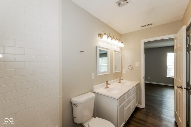 8310 Becks Mill Ln, Indianapolis, IN 46113 - bathroom featuring wood finished floors and double vanity