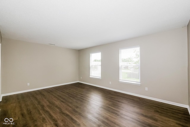 8310 Becks Mill Ln, Indianapolis, IN 46113 - spare room with dark wood-style flooring and baseboards