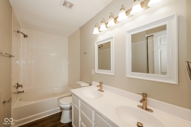 8310 Becks Mill Ln, Indianapolis, IN 46113 - full bathroom featuring double vanity,  shower combination, and wood finished floors