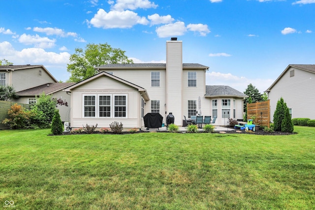 9653 Cypress Way, Carmel, IN 46032 - back of property featuring a chimney, a patio area, and outdoor lounge area