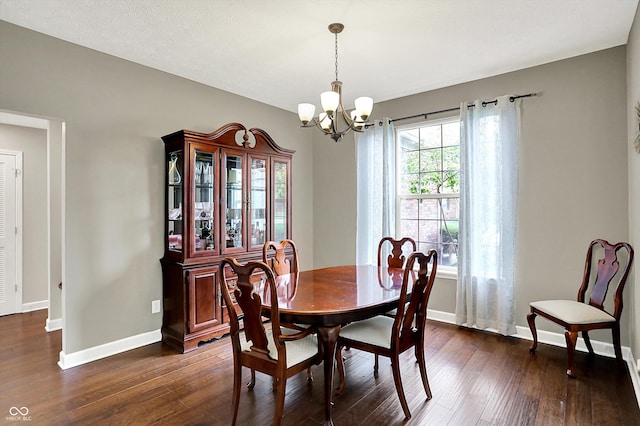 9653 Cypress Way, Carmel, IN 46032 - dining room with a chandelier and dark wood-style floors