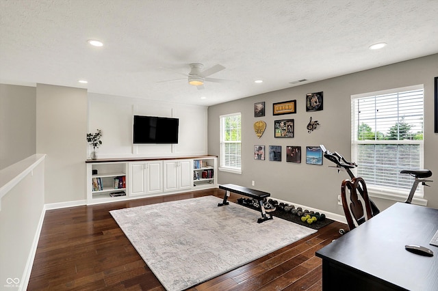 9653 Cypress Way, Carmel, IN 46032 - workout room with ceiling fan, dark wood finished floors, a textured ceiling, and recessed lighting