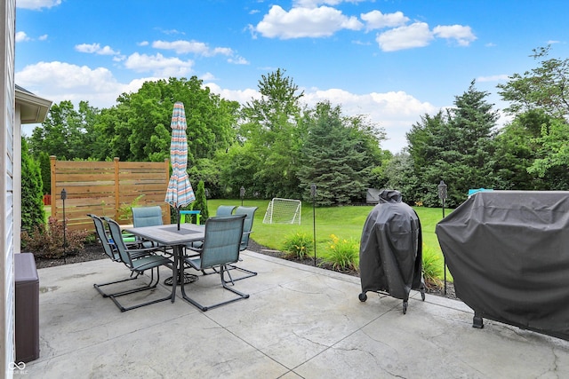 9653 Cypress Way, Carmel, IN 46032 - view of patio / terrace featuring outdoor dining space, a grill, and view of scattered trees