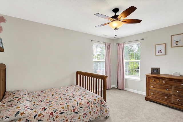9653 Cypress Way, Carmel, IN 46032 - bedroom featuring light carpet and ceiling fan