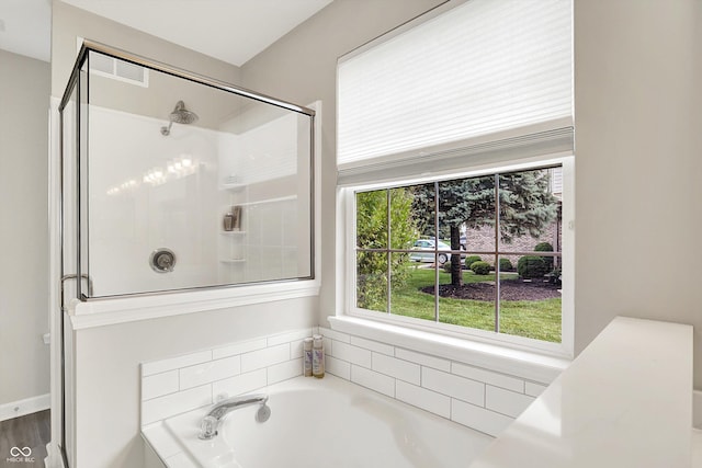 9653 Cypress Way, Carmel, IN 46032 - full bathroom featuring a garden tub and a shower with door