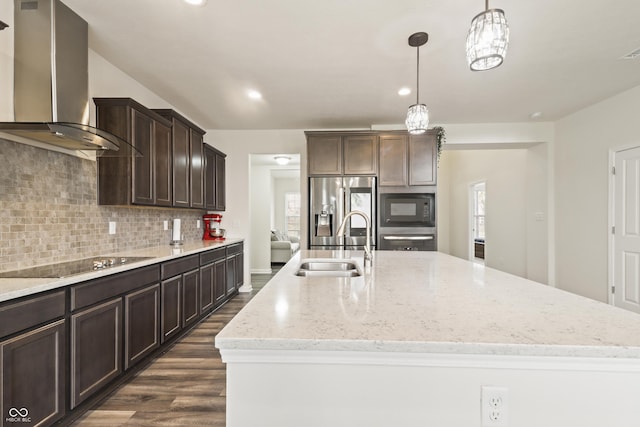10811 Wild Orchard Ln, Indianapolis, IN 46239 - kitchen with wall chimney exhaust hood, black appliances, dark wood finished floors, a kitchen island with sink, and backsplash